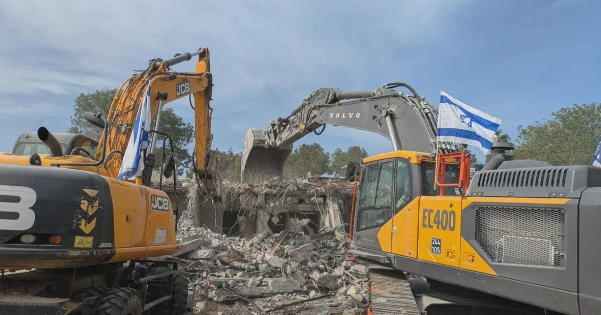 I Stand Before a Bulldozer That Is Leveling My Mother's Home, and Wonder Why It Flies an Israeli Flag
