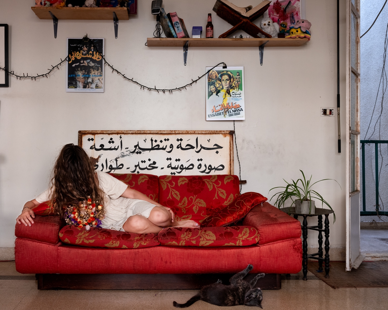 "Maya (Odalisque With Cat)," Beirut, Lebanon, 2024 (The sign says: Surgery, Endoscopy, X-ray, Ultrasound, Lab, Emergency)
