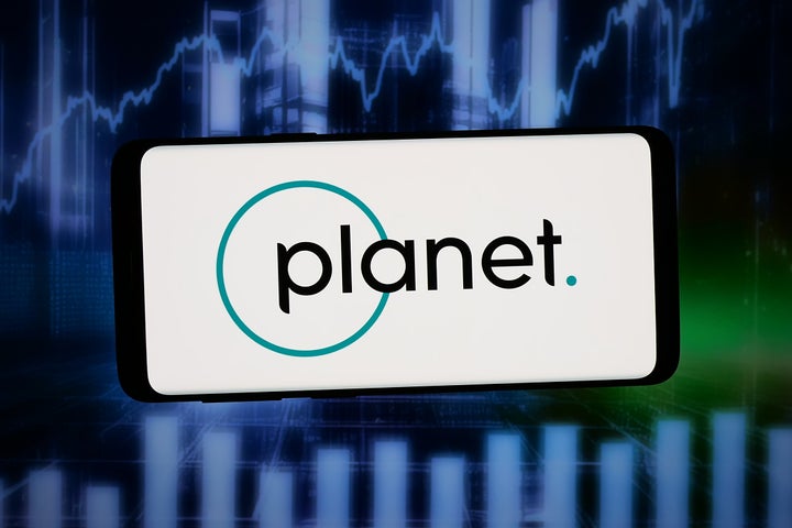 GERMANY - 2026/03/10: In this photo illustration, the logo of US satellite imagery company Planet Labs PBC is displayed on a smartphone in front of abstract background on computer screen.