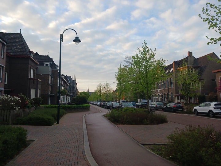 A typical Dutch street with walking and biking paths separated from vehicular traffic