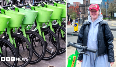 Two Lime bikers ride in front of a London bus on a city centre street.