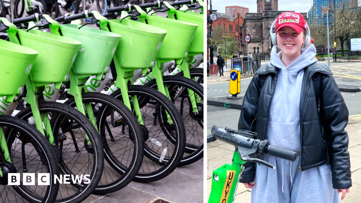 Two Lime bikers ride in front of a London bus on a city centre street.