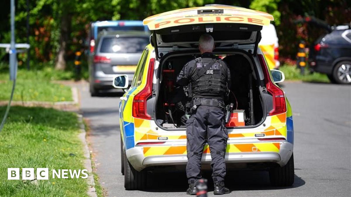 Police officers patrol at a cordon near to an incident at the Kenton United Synagogue in Harrow