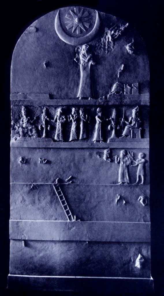 Ancient Mesopotamian relief showing figures under celestial symbols, depicting a mythological scene with gods and humans in distinct registers
