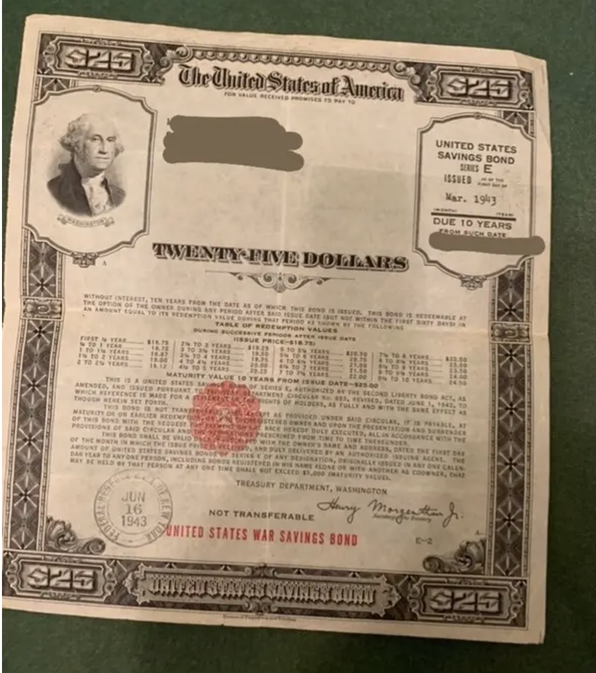 A U.S. Savings Bond from 1943, valued at $25, featuring a portrait of George Washington and redemption details