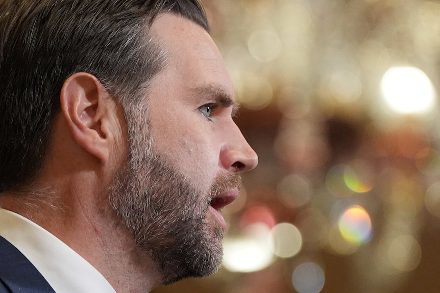 A close up of the side of JD Vance's face as he speaks