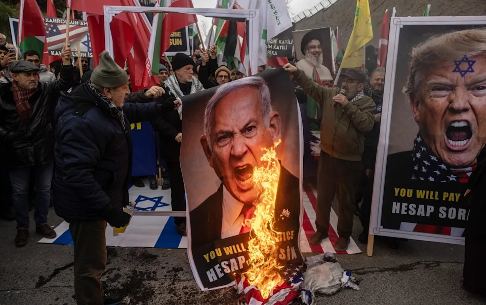 Protesters burn pictures of Donald Trump and Benjamin Netanyahu during a rally outside the US consulate in Istanbul earlier this year