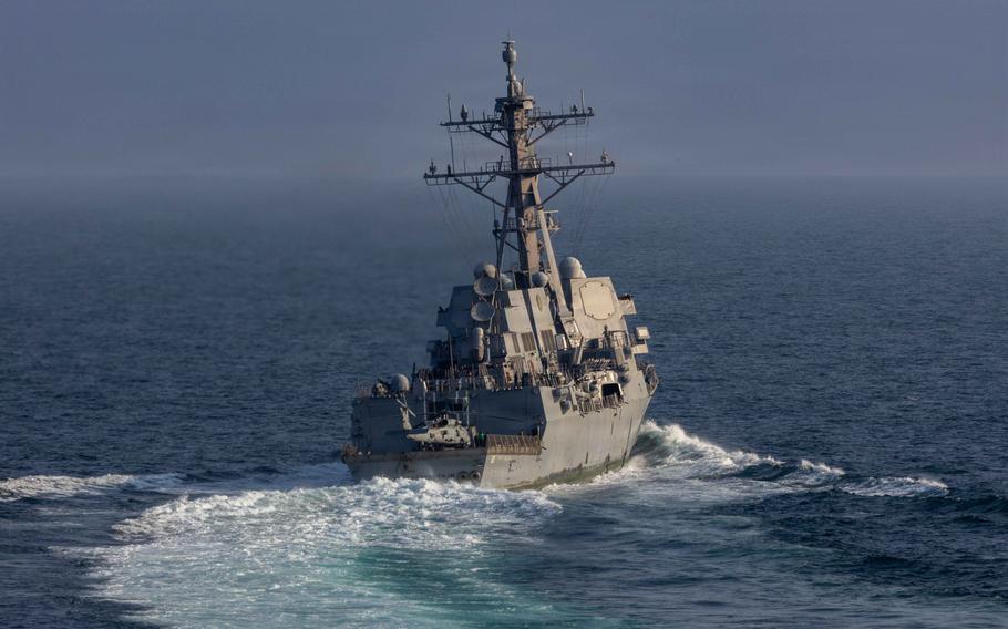 A missile destroyer cuts across the sea.