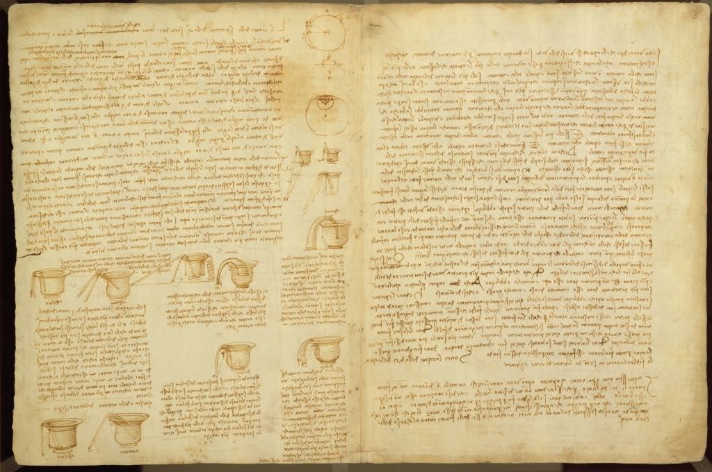 Old manuscript page with sketches and mirrored handwritten text, showcasing technical drawings and notes