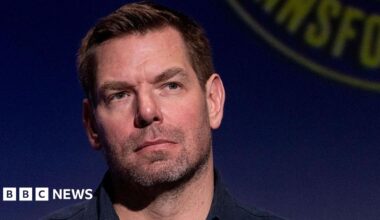 Eric Swalwell wears a dark blue button down shirt at a candidate forum in Los Angeles last year.