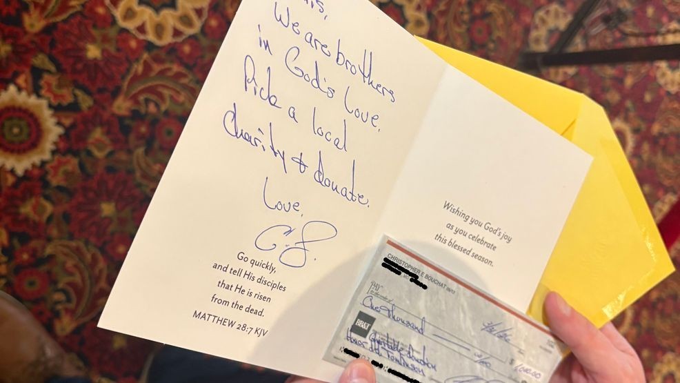 An Easter card that Del. Chris Tomlinson, R-Carroll and Frederick counties, received from his seatmate, Del. Eric Bouchat, after calling for his resignation. The card and blank checks were sent after Spotlight on Maryland asked Bouchat if he thought he was stealing taxpayer money by collecting a state salary and purposely not working. Private information was redacted from this photo. (Gary Collins/Spotlight on Maryland){p}{/p}