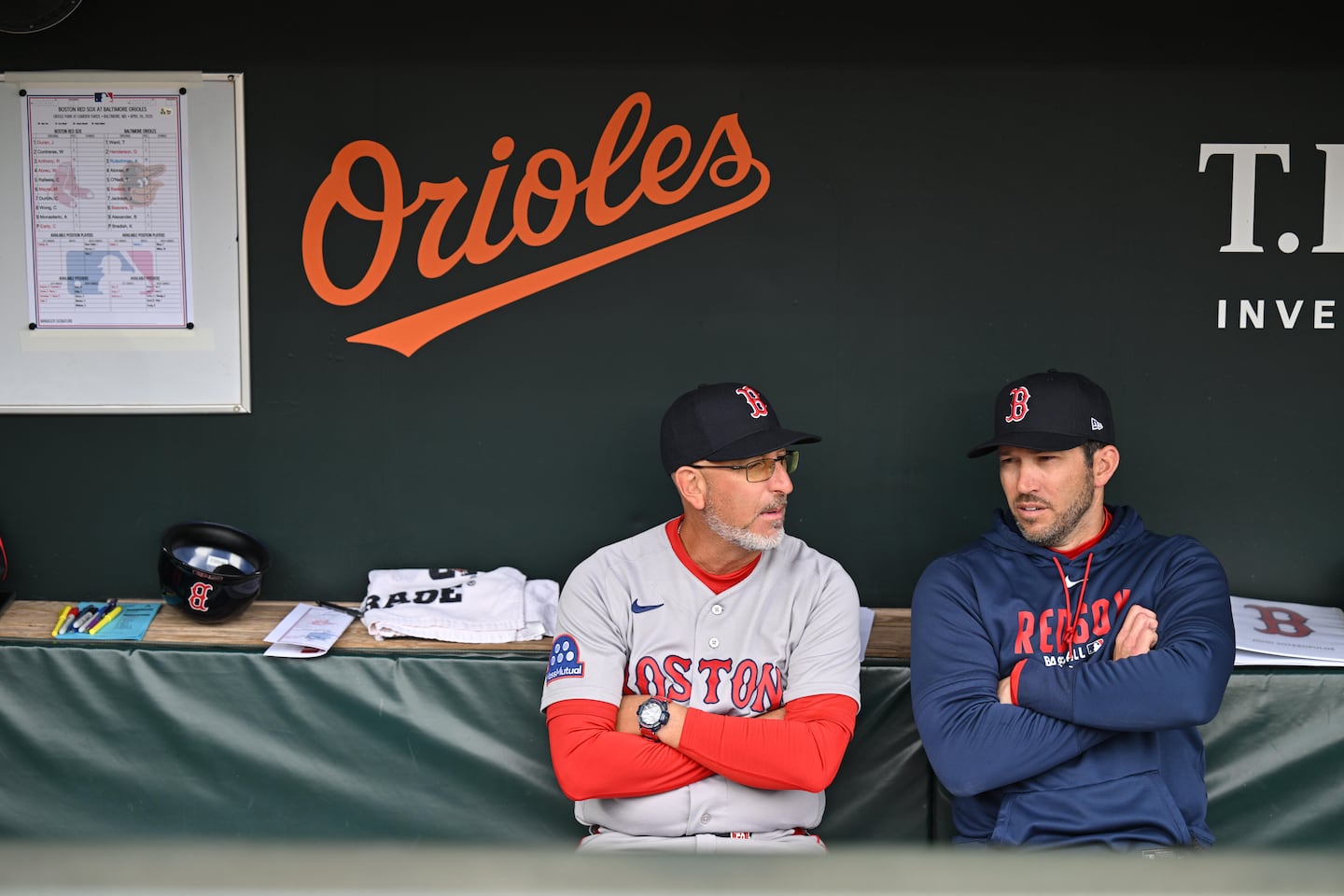José David Flores (left) moved from first base coach to bench coach to assist interim manager Chad Tracy.