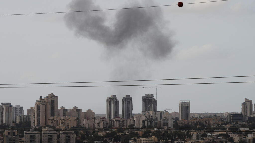 Smoke billows in Beersheba, southern Israel after it was struck by an Iranian missile.