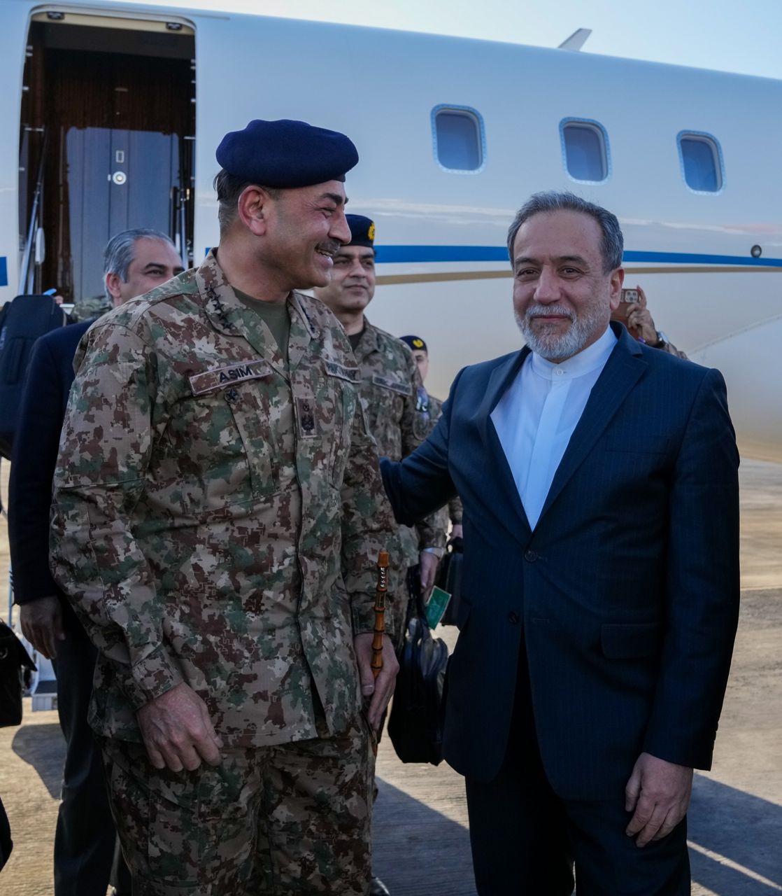 In this photo released by the Iranian Foreign Ministry, Pakistan's Army Chief Field Marshal Gen. Asim Munir, left, is welcomed by Iranian Foreign Minister Abbas Araghchi upon his arrival in Tehran, Wednesday, April 15, 2026. (Iranian Foreign Ministry via AP)
