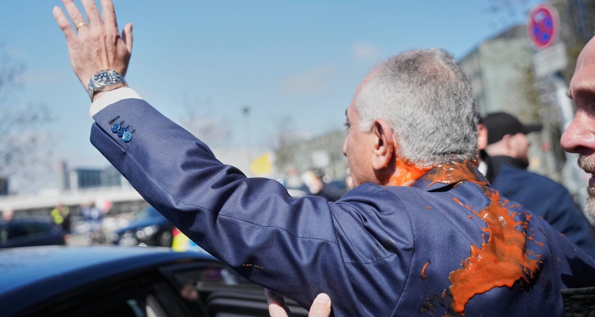 Iran's exiled crown prince splashed with red liquid after railing against ceasefire