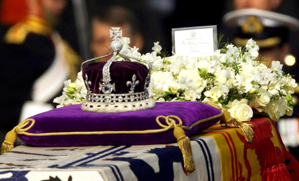 The Koh-i-noor, or "mountain of light," diamond, set in the Maltese Cross at the front of the crown made for Britain's late Queen Mother Elizabeth, is seen on her coffin on April 5, 2002