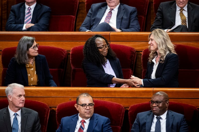 Sister Theresa A. Collins greets incoming Primary General President Rosemary K. Chibota while they’re joined by Sister Nina M. Garfield in the Conference Center in Salt Lake City on Saturday, April 4, 2026.
