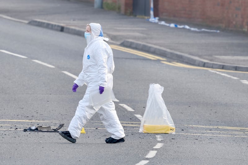 Forensics at the scene of an explosion outside Dunmurray Police Station. PICTURE: MAL MCCANN m