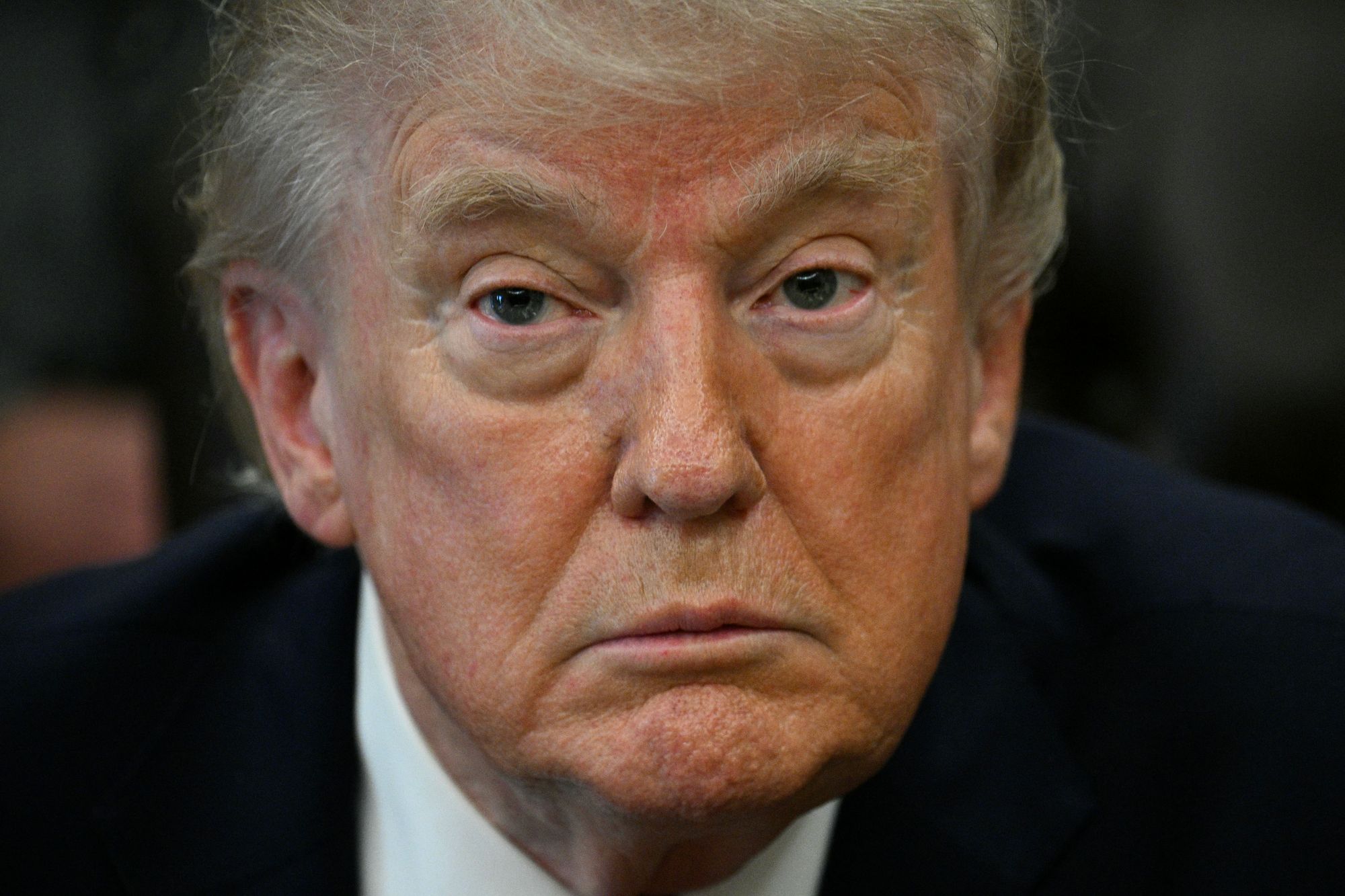 Donald Trump addresses the media after signing an executive order in the Oval Office of the White House on 18 April