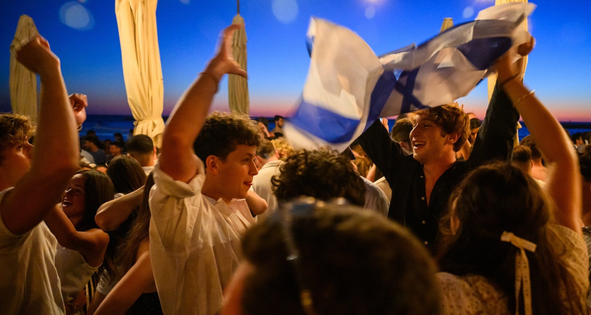 dancers waving israeli flags