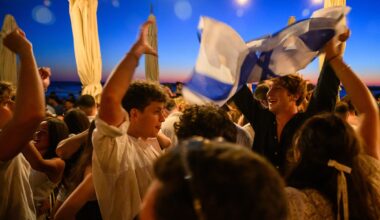 dancers waving israeli flags