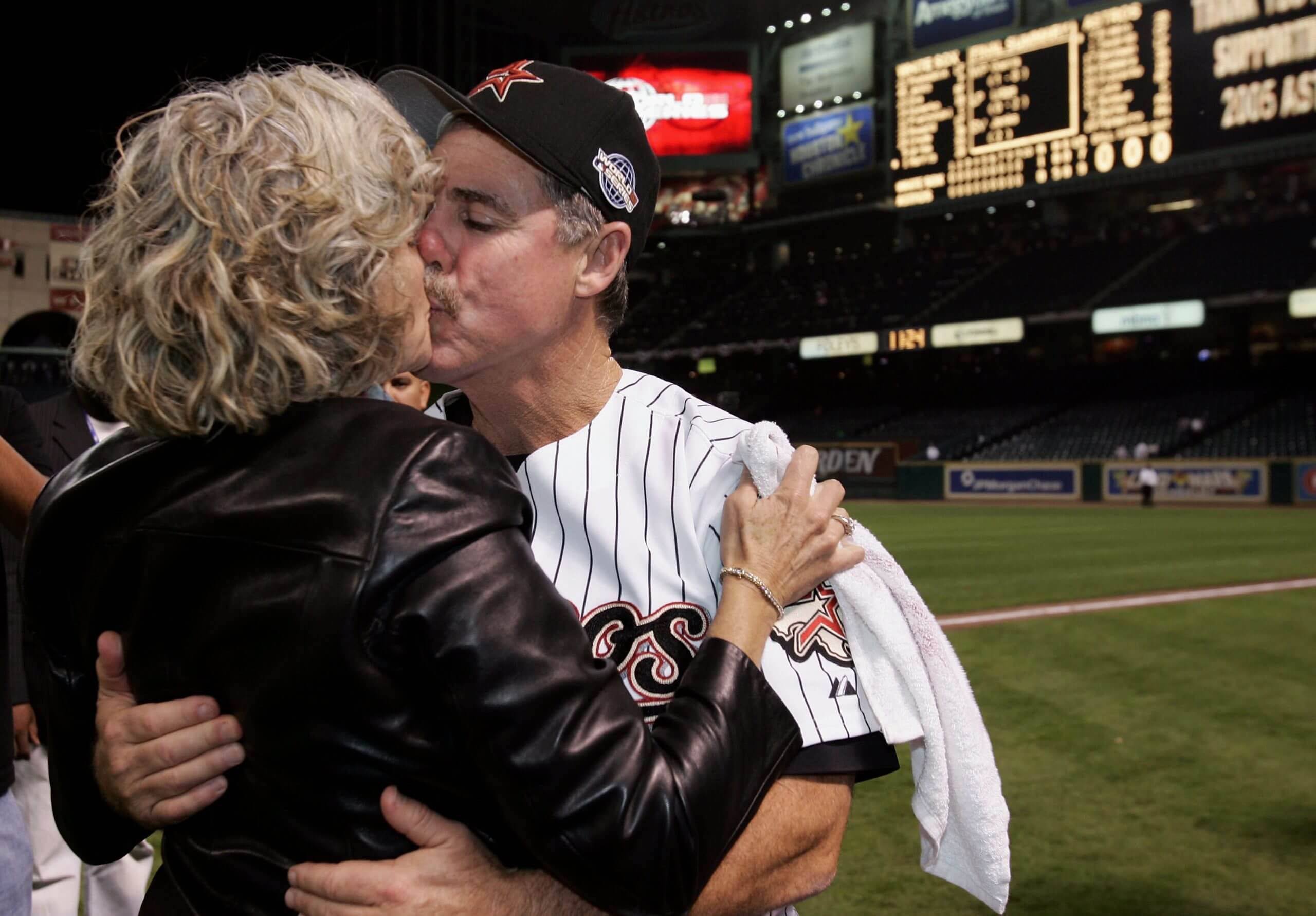 Phil Garner kisses his wife, Carol, at Minute Maid Park.
