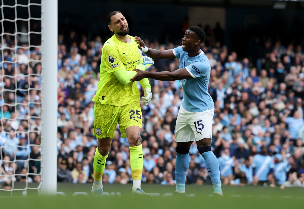 MANCHESTER, ENGLAND - APRIL 19: Gianluigi Donnarumma of Manchester City looks dejected after miss kicking his clearance straight to Kai Havertz of Arsenal (not pictured), who scores his team's first goal during the Premier League match between Manchester City and Arsenal at Etihad Stadium on April 19, 2026 in Manchester, England. (Photo by Michael Regan/Getty Images)