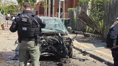 Iranian cluster missile scatters impact sites across central Israel