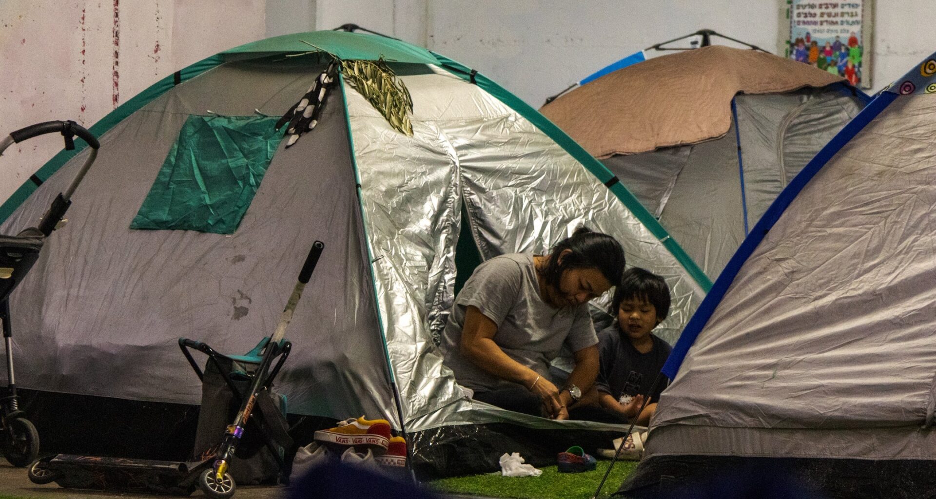 Sheltering in Tel Aviv's bus station, foreign workers face unique plight in wartime
