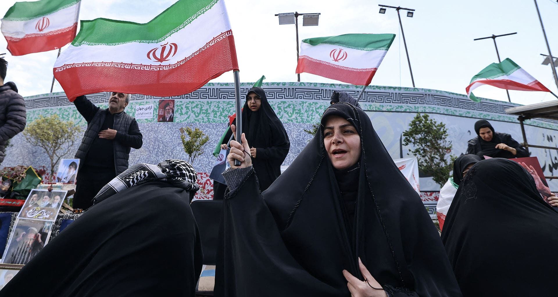 Carla Anne Robbins in black and white over a blue graphic design background