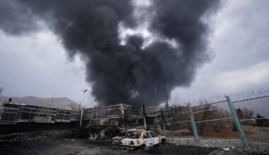 A thick plume of smoke rises from an oil storage facility hit by a U.S.-Israeli strike in Tehran, Iran, March 8, 2026.