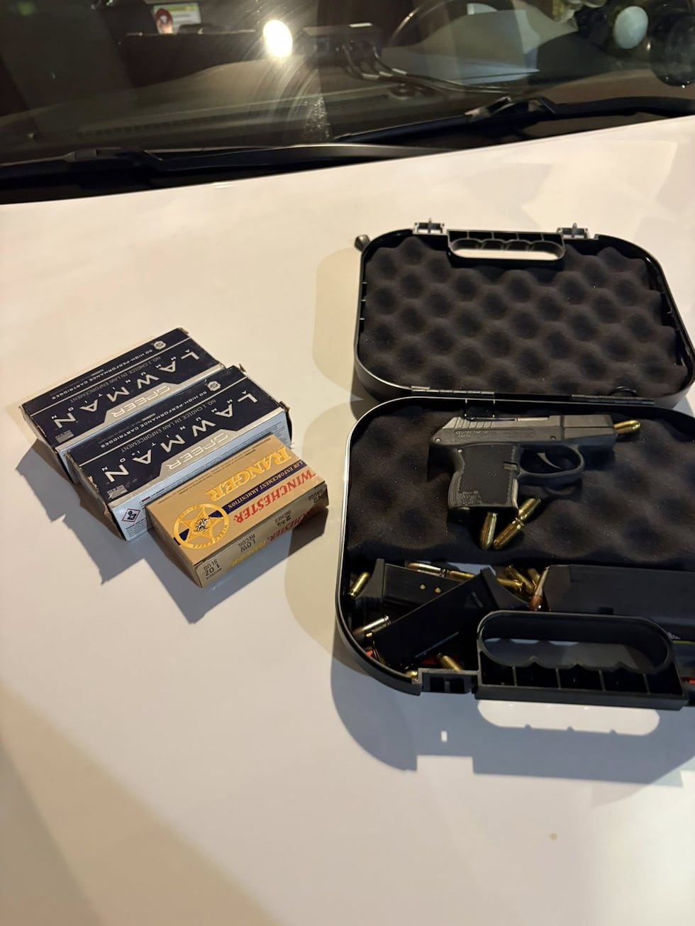 A handgun and ammunition shown by authorities during the investigation into an alleged mass...