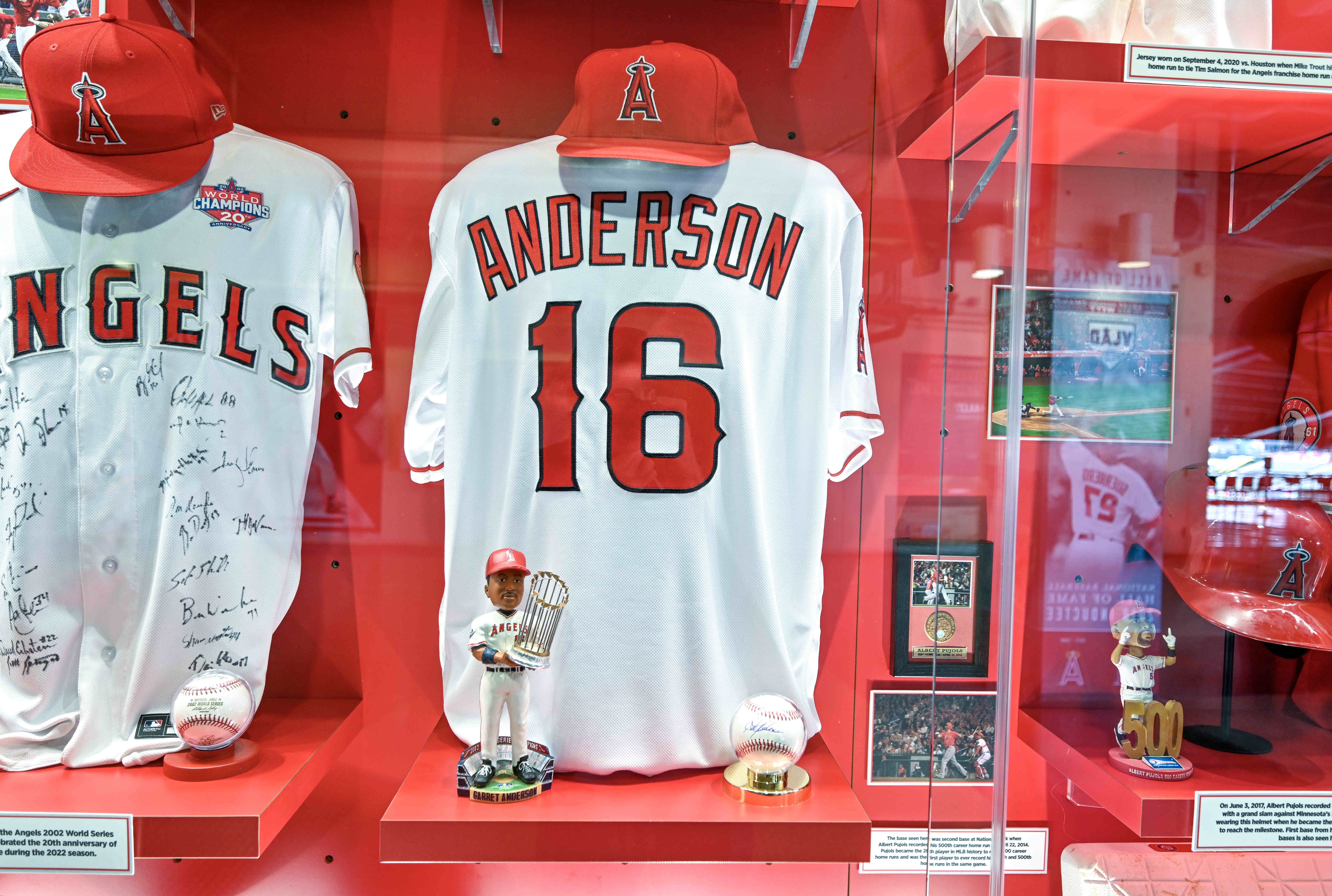 A jersey, bobblehead, and a ball signed by Garret Anderson,...