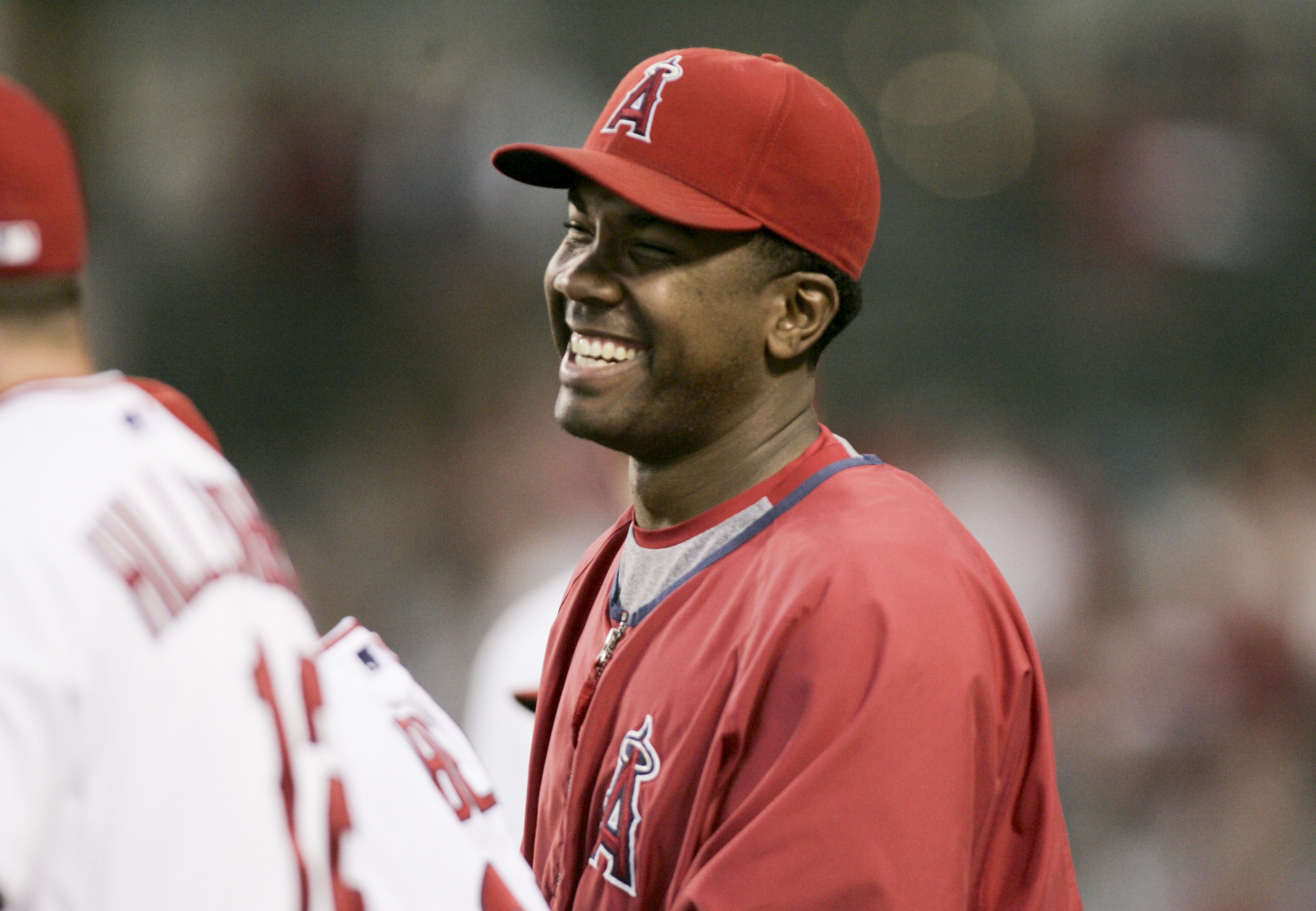 The Angels’ Garret Anderson shares a laugh with teammates during...