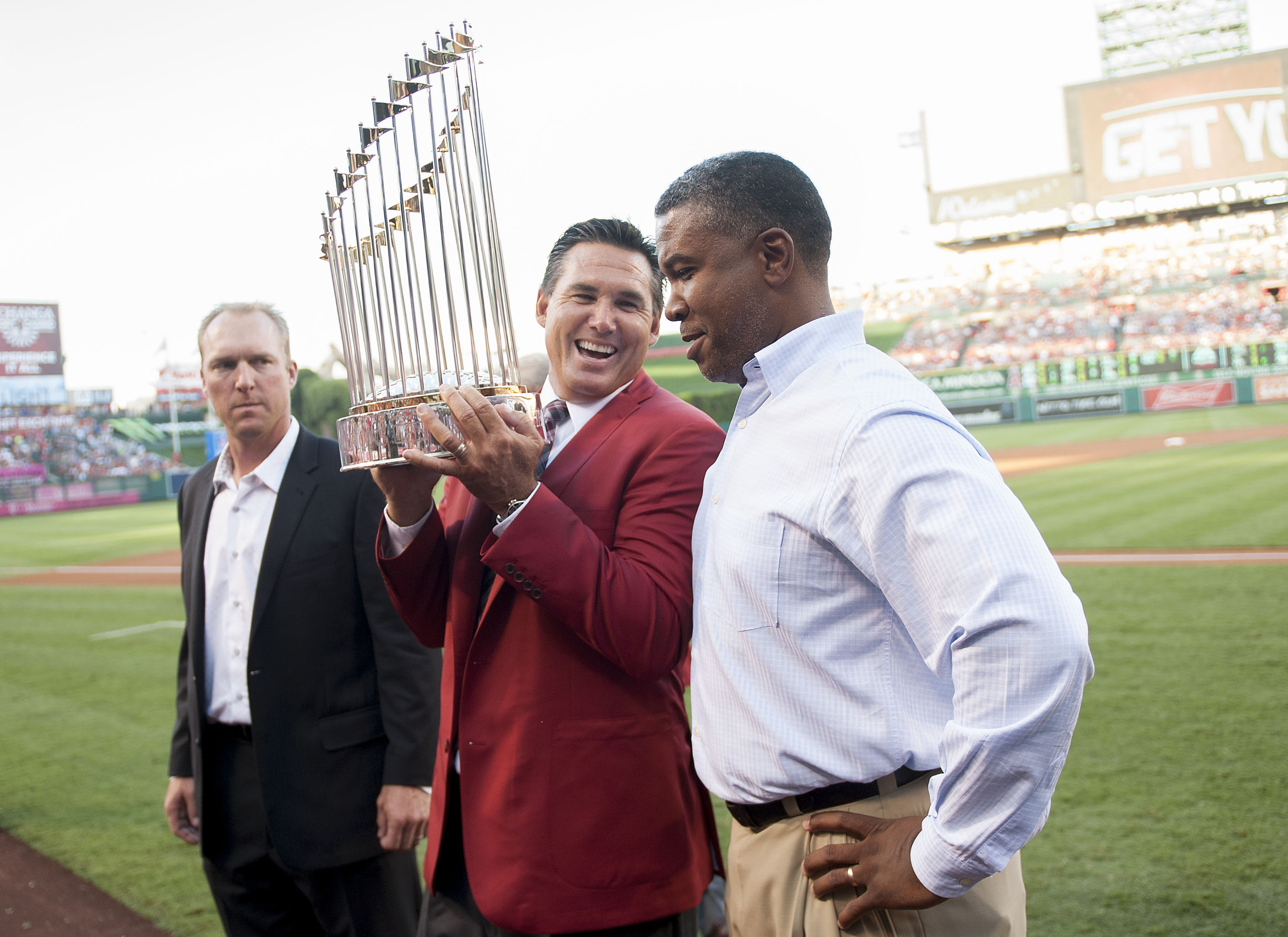Tim Salmon shares a laugh with former teammates Darin Erstad,...