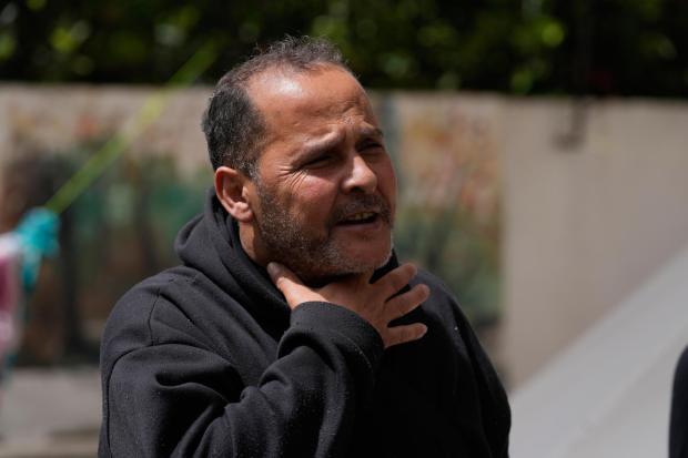 Ali al-Salim gestures during an interview with The Associated Press in Sidon, Lebanon.