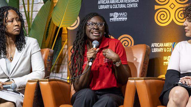 Coral Springs Commissioner Nancy Metayer Bowen, center, speaks during the Out of Many, One Community: Combating Anti-Immigrant Rhetoric panel discussion hosted by South Florida People of Color at the African-American Cultural Research Center on Thursday, October 17, 2024, in Miami, Fla. 