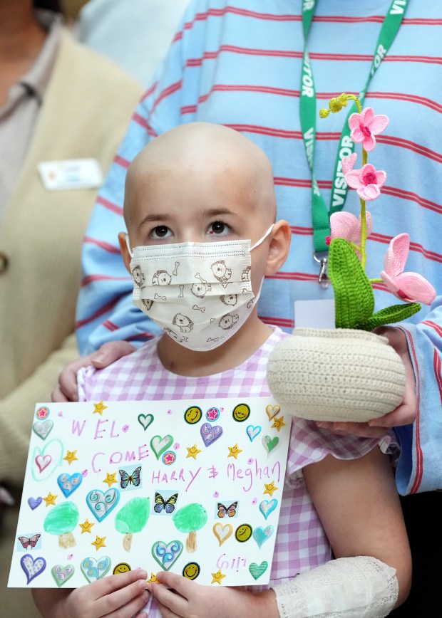 MELBOURNE, AUSTRALIA - APRIL 14: A young child waits for the arrival of Prince Harry, Duke of Sussex and Meghan, Duchess of Sussex during their visit to the Royal Children's Hospital on April 14, 2026 in Melbourne, Australia. The Duke and Duchess of Sussex are on a four-day visit to Australia, with engagements across Melbourne, Canberra and Sydney. (Photo by Asanka Ratnayake/Getty Images)