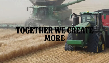 A screencap from the Monette Farms website showing a combine harvesting with a tractor pulling a grain cart alongside.