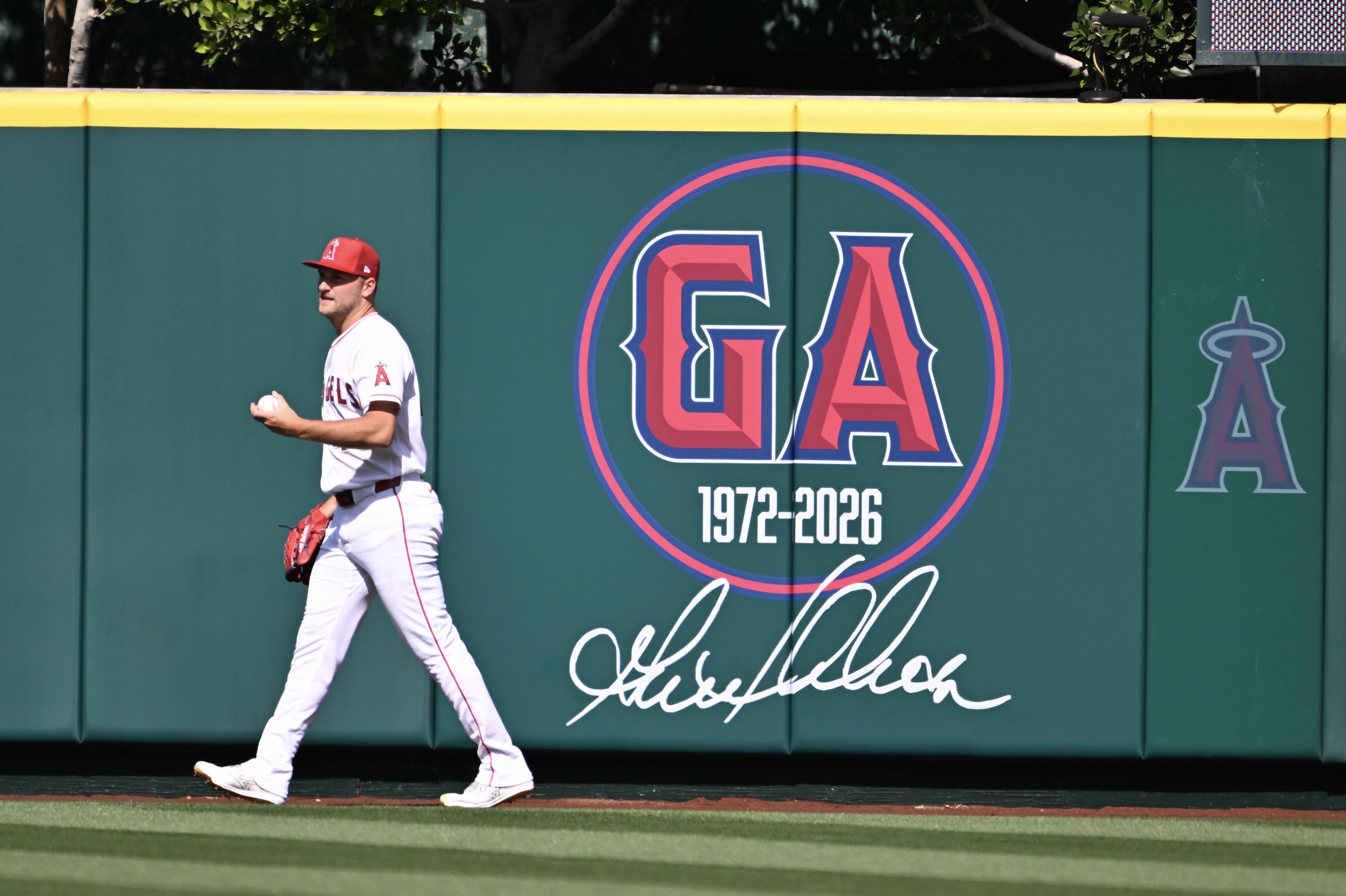 Reid Detmers #48 of the Los Angeles Angels walks past...