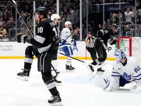 Los Angeles Kings left wing Artemi Panarin, left, celebrates after scoring on Toronto Maple Leafs goaltender Joseph Woll on Saturday in Los Angeles.