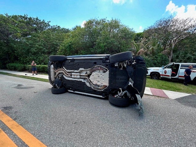 Tiger Woods' Land Rover rolled over on a two-lane road near his Jupiter Island home