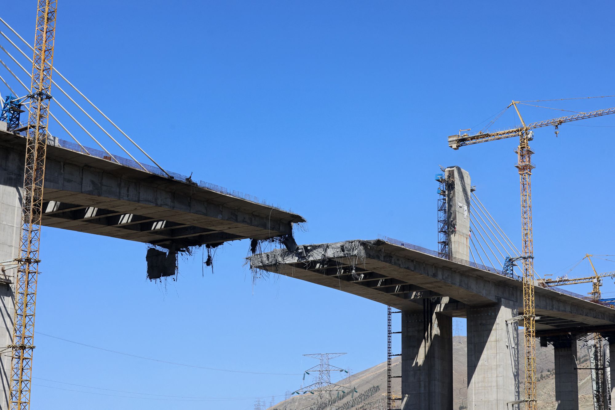 A view of the B1 bridge is pictured, a day after it was destroyed by a strike in Karaj, southwest of Tehran