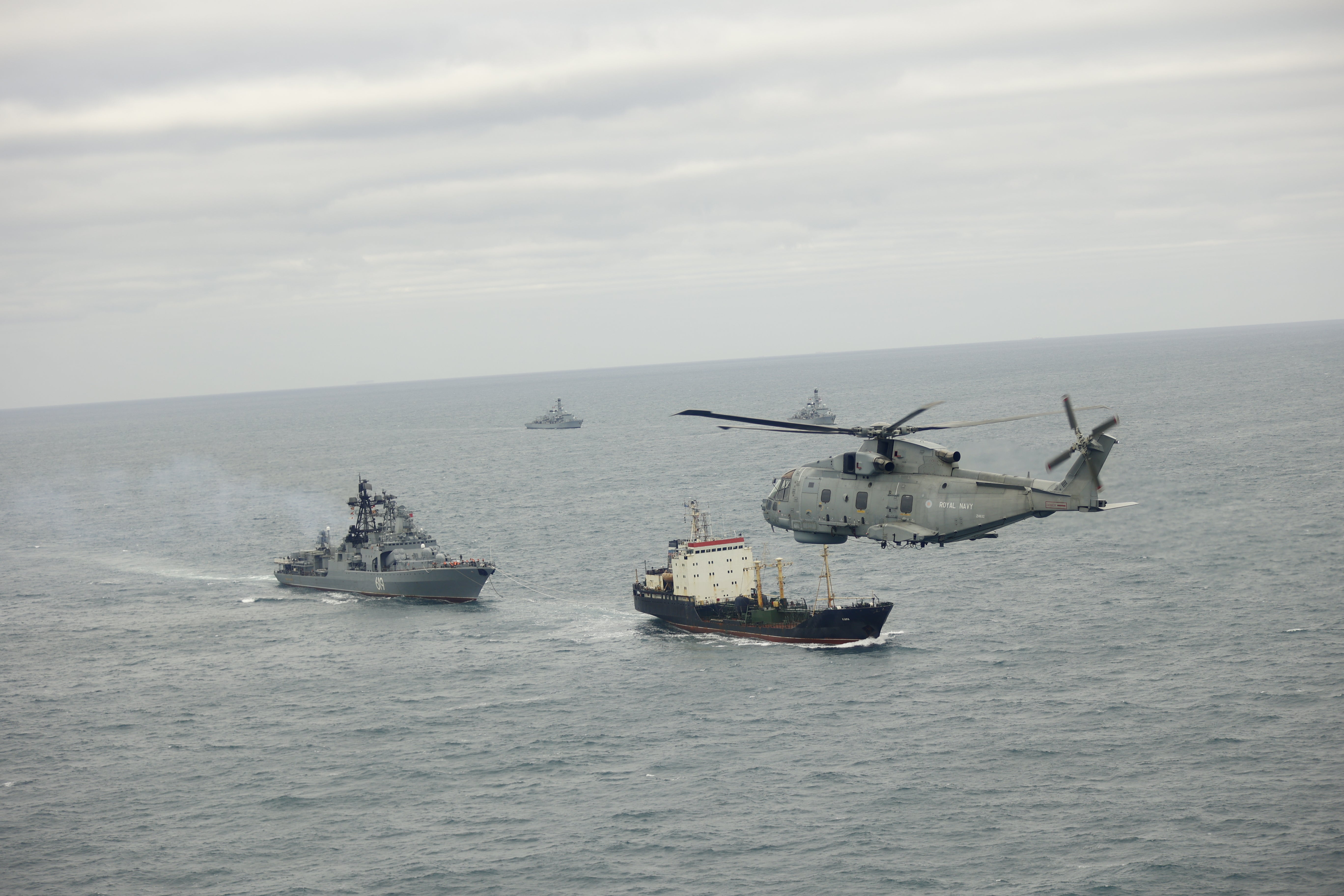 HMS Somerset and HMS St Albans with a Merlin helicopter tracking a Russian vessel
