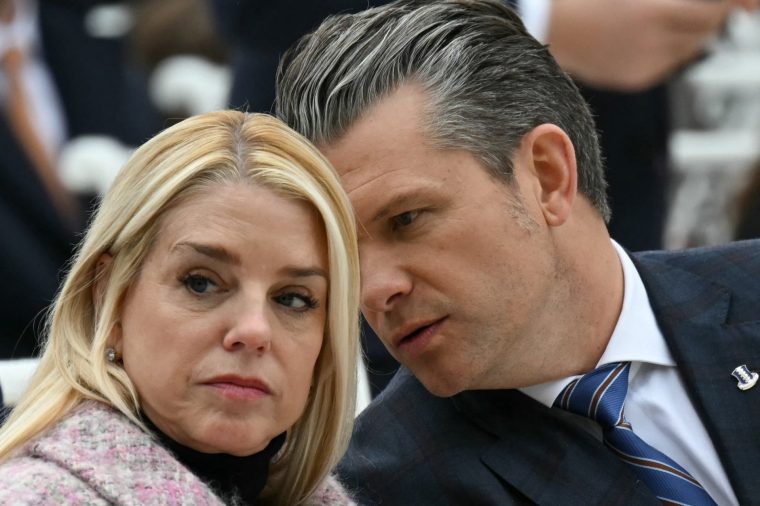 (FILES) (L/R) US Attorney General Pam Bondi and Secretary of Defense Pete Hegseth speak with each other before the start of the White House turkey pardon ceremony in the Rose Garden of the White House in Washington, DC on November 25, 2025. US media reported on April 2, 2026, that US President Donald Trump has fired Attorney General Pam Bondi. (Photo by ANDREW CABALLERO-REYNOLDS / AFP via Getty Images)
