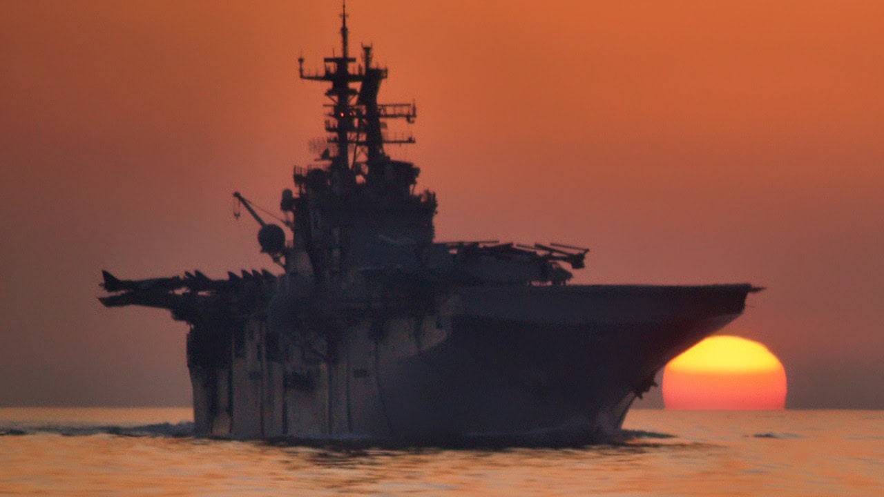 The amphibious assault ship USS Bataan (LHD 5) transits the Strait of Hormuz.