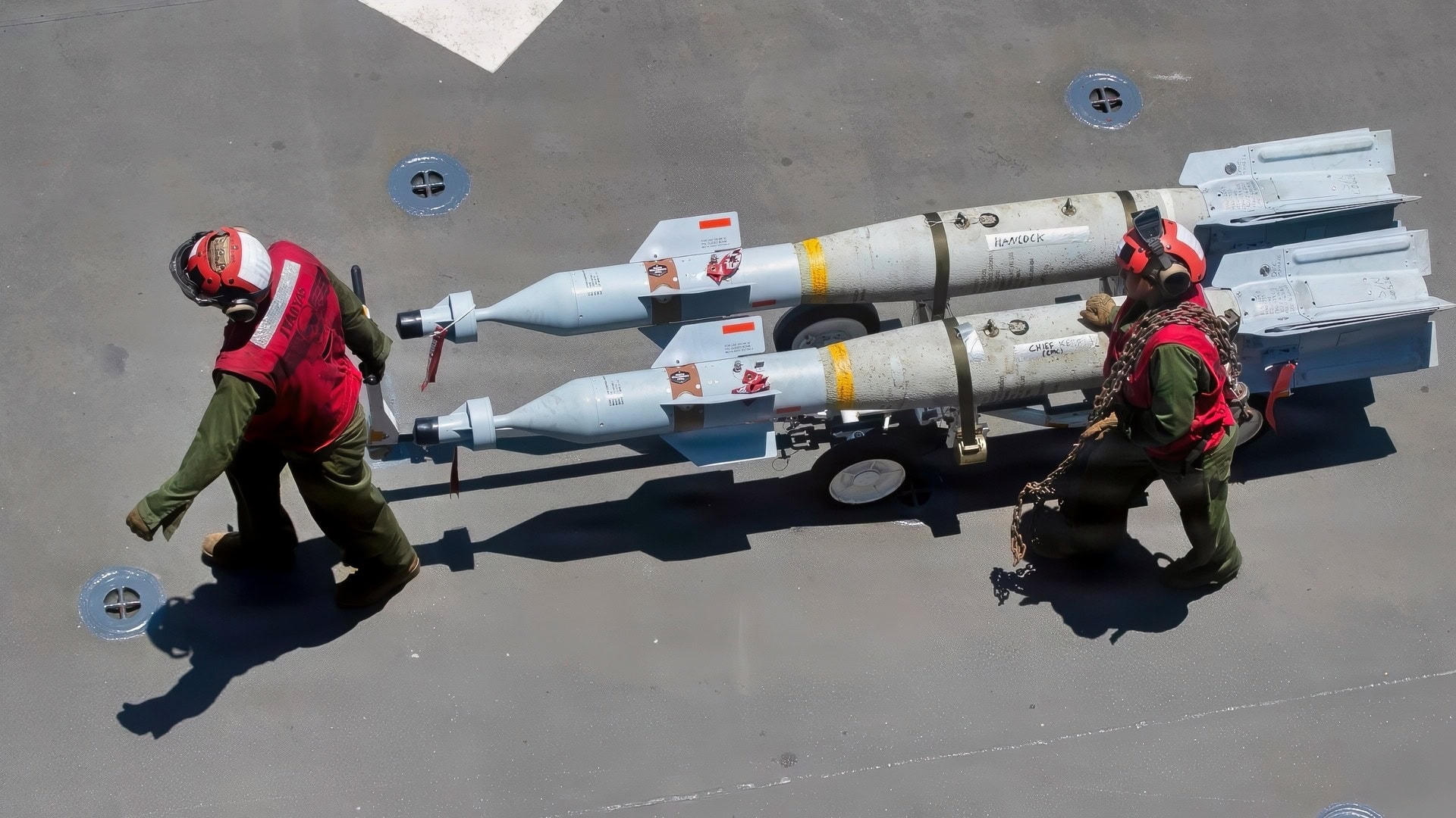 U.S. Marines, with the 31st Marine Expeditionary Unit (MEU), transport ordinance on the flight deck of America-class amphibious assault ship USS Tripoli (LHA 7), Mar. 20, 2026. Tripoli is currently underway conducting routine operations in the U.S. 7th Fleet area of operations. U.S. 7th Fleet, is the U.S. Navy’s largest forward-deployed numbered fleet, routinely interacts and operates with allies and partners in preserving a free and open Indo-Pacific. (U.S. Navy photo by Mass Communication Specialist Seaman Apprentice Reese Mitchell Taylor)