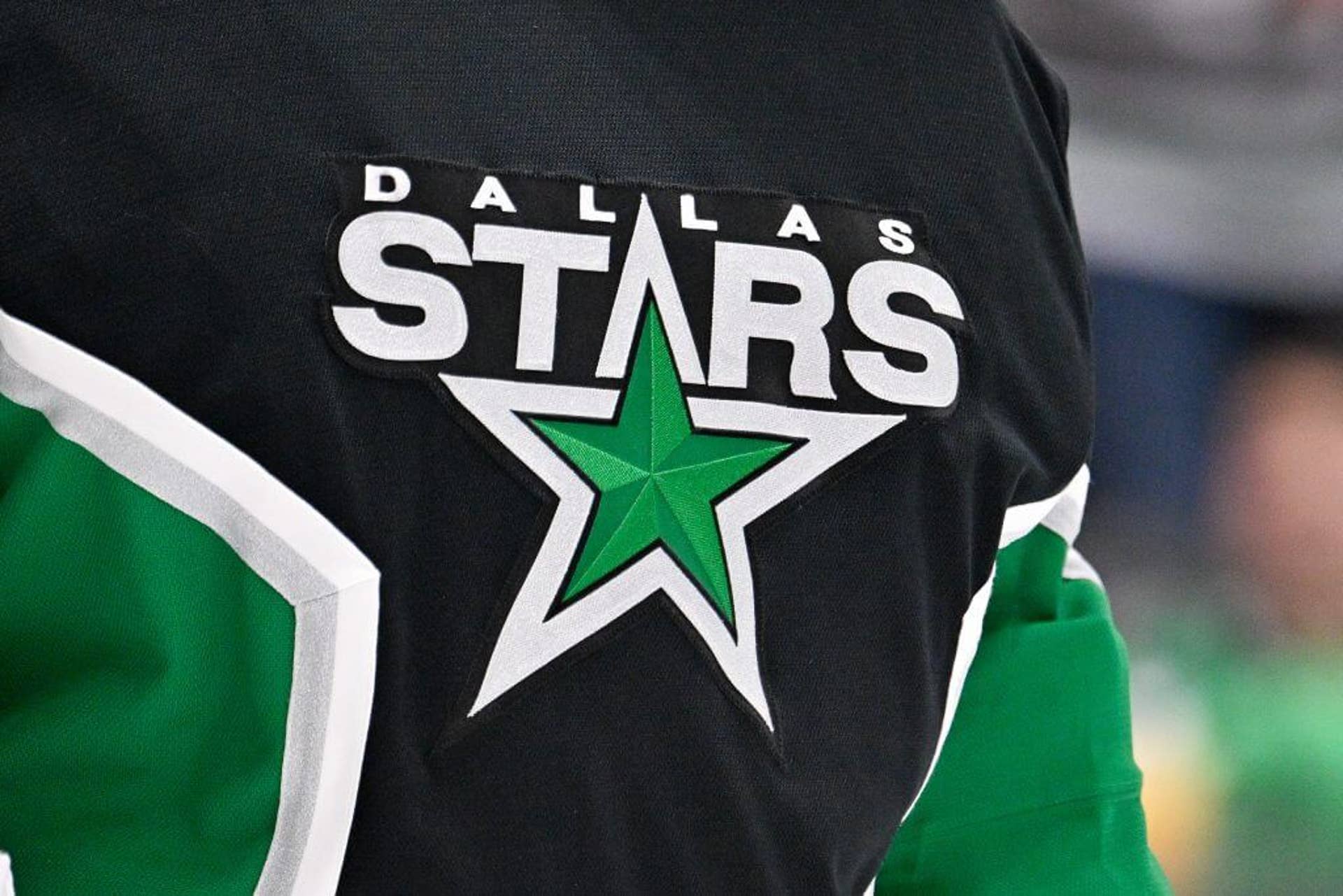 A view of the Dallas Stars logo on the jersey of goaltender Jake Oettinger.