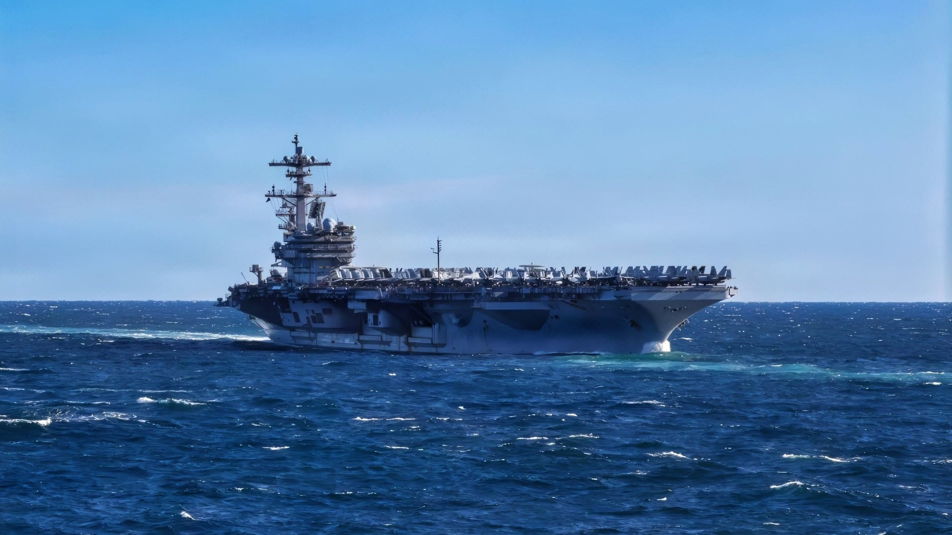The USS George H.W. Bush Carrier Strike Group sails in formation during a strait transit exercise in the Atlantic Ocean, Feb. 8, 2026. The George H.W. Bush Carrier Strike Group is at sea as an integrated warfighting team. Composite Training Unit Exercise (COMPTUEX) is the Joint Force’s most complex integrated training event and prepares naval task forces for sustained high-end Joint and combined combat. Integrated naval training provides combatant commanders and America’s civilian leaders highly capable forces that deter adversaries, underpin American security and economic prosperity, and reassure Allies and partners. (U.S. Navy photo by Mass Communication Specialist 3rd Class John R. Farren)