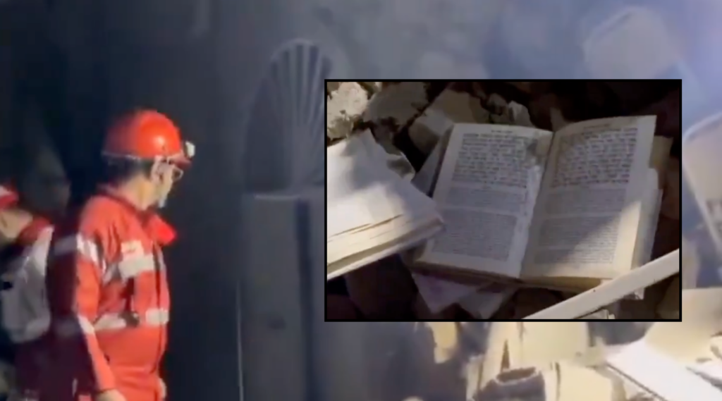 A photo of prayer books in rubble and a worker.